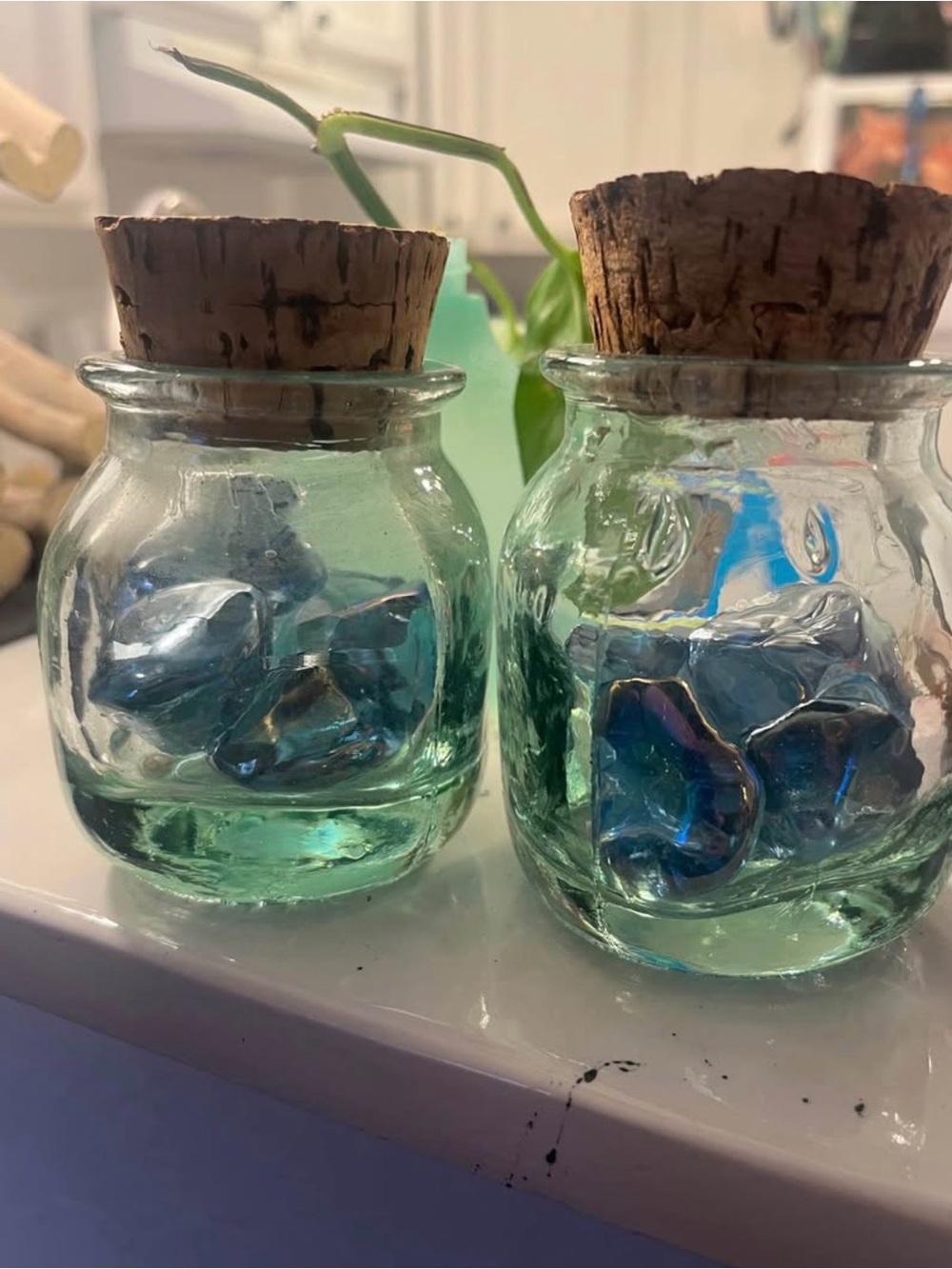 Clear glass apothecary jars with cork lids